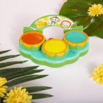 A Bright Starts Safari Beats musical drum toy featuring three colorful drums with lights, designed for babies aged 3 months a