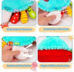 A cyan plush crab toy with large eyes and a friendly smile, shown in a crawling position with musical notes around it.