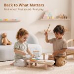 Promise Babe Wooden Drum Set for toddlers with xylophone, drums, cymbals, and wind chime on a wooden table.