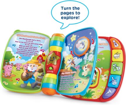 A red VTech Musical Rhymes Book, open to a colorful page with interactive elements and piano keys.