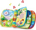 A red VTech Musical Rhymes Book, open to a colorful page with interactive elements and piano keys.