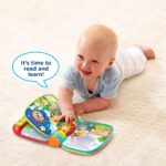 A red VTech Musical Rhymes Book, open to a colorful page with interactive elements and piano keys.